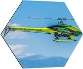 WallClassics - Dibond Hexagon - Geel Groene Helikopter bij Wolken - 60x52.2 cm Foto op Hexagon (Met Ophangsysteem)