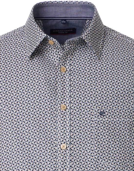Herenshirt met kraag, knopen en borstzak. Het shirt heeft een all-over print met kleine, abstracte vormen in donkerblauw en beige.