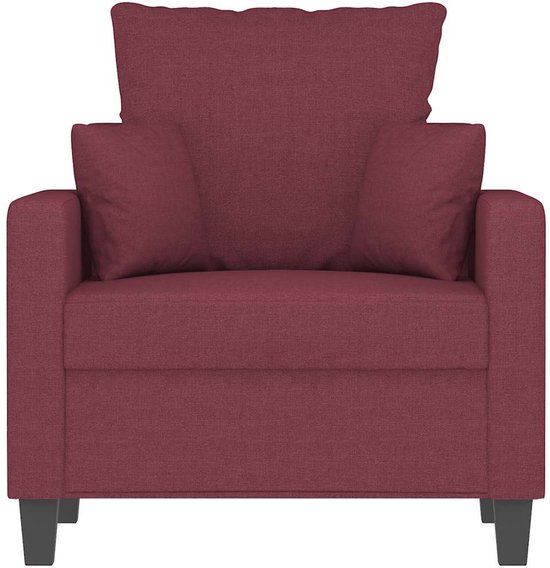 Wijnrode fauteuil met losse kussens en zwarte pootjes.