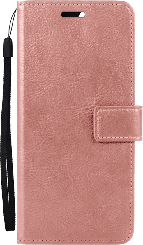 Étui portefeuille rosé doré avec texture cuir brossé, dragonne et fermeture magnétique. Ouvert.