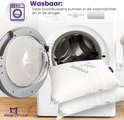Twee witte kussens met bamboe print naast een openstaande wasmachine.