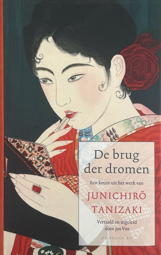 Boek 'De brug der dromen' met een illustratie van een vrouw in rode kimono die lippenstift aanbrengt.