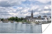 Uitzicht op Maastricht met lichte bewolking Poster 120x80 cm - Foto print op Poster (wanddecoratie woonkamer / slaapkamer) / Europese steden Poster