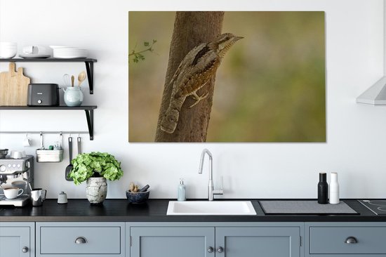 Tableau sur toile Un torsadé assis contre une branche - 140x90 cm - Décoration murale