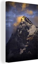 Canvas Schilderij Bewolkte Eiger bij zonsondergang in Zwitserland - 60x90 cm - Wanddecoratie