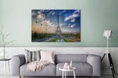 Canvas schilderij 140x90 cm - Wanddecoratie De Eiffeltoren met op de achtergrond luchtballonnen die in de lucht varen boven Parijs - Muurdecoratie woonkamer - Slaapkamer decoratie - Kamer accessoires - Schilderijen