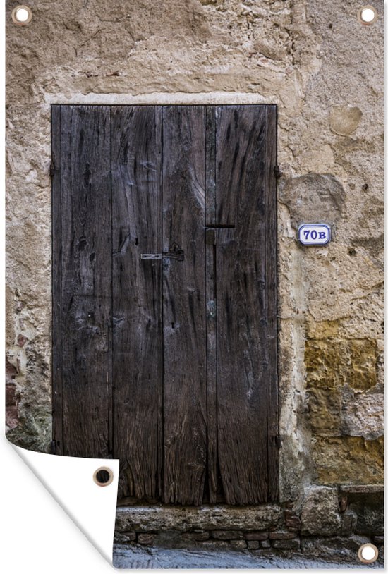 Tuinposter - Tuindoek - Tuinposters buiten - Een oude houten deur bij een oude muur in het Italiaanse Toscane - 80x120 cm - Tuin