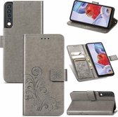 Voor LG Stylo 7 4G Vier-blad Sluiting Reliëf Gesp Mobiele Telefoon Bescherming Lederen Case met Lanyard & Card Slot & Portemonnee & Beugel Functie (Grijs)