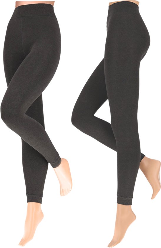 Donkergrijze naadloze legging, getoond op twee paspoppen. Rechts een model met voetzooltjes.