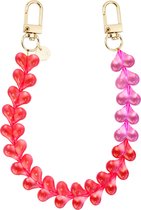 xoxo Wildhearts telefoonkoord - Funky Hearts - transparant roze en rood - Geschikt voor iPhone - Geschikt voor Samsung - Universeel Phone Cord - Telefoonketting - Bedeltje voor telefoon - Telefoonhanger - kralenketting met hartjes - Roze / Rood