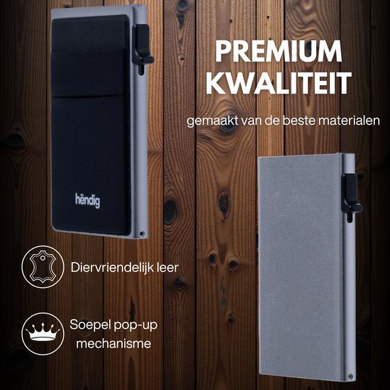 Zijzicht op zilverkleurige Hëndig pasjeshouder met zwart vak en soepele pop-up mechanisme.