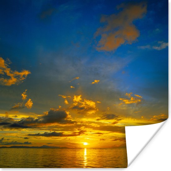 Poster Oranje zonsondergang met blauwe lucht