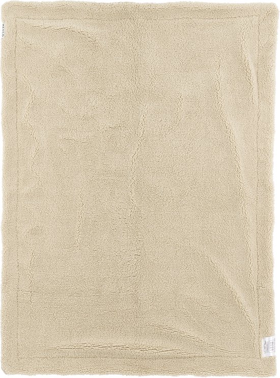 Een beige teddy wiegdeken van Meyco.