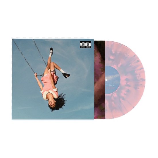 Disque vinyle avec des éclaboussures roses, violettes et blanches. La pochette montre une fille en robe rose sur une balançoire sous un ciel bleu.