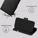 Zwarte book case met labels 'Schokabsorptie' en 'Comfort stand'.