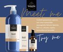 Blauwe pompflacon massageolie 'Belaste Spieren' van Volatile, naast een crème doosje en een bruine fles.