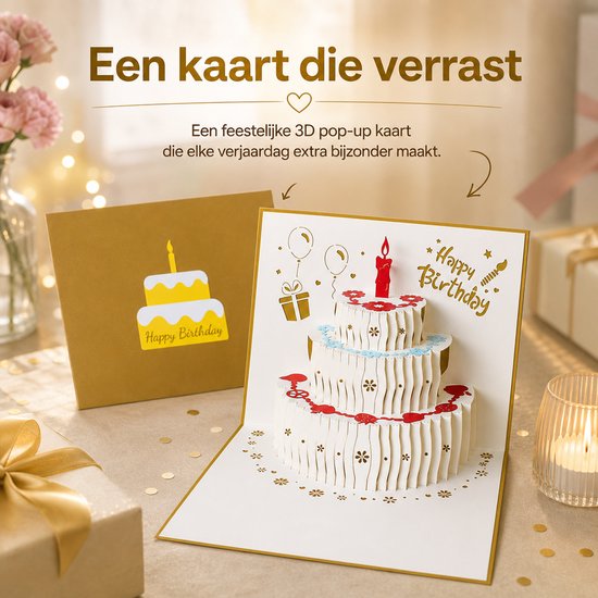 Een 3D pop-up verjaardagskaart met een witte taart, naast een geschenk en bloemen. De kaart staat open op een tafel.