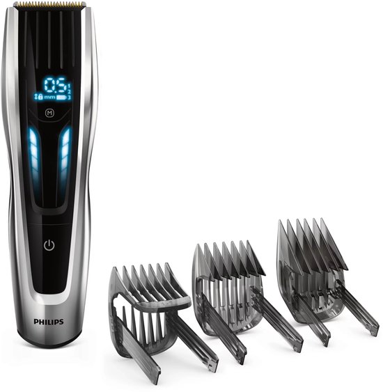 Philips tondeuse met digitaal display en drie opzetkammen.