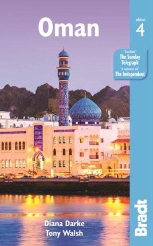 Boek 'Oman', editie 4, met een foto van een moskee en gebouwen bij zonsondergang.