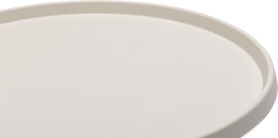 Close-up van een beige, ovale placemat van siliconen.