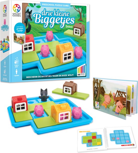 De verpakking van het spel 'Drie Kleine Biggetjes Deluxe' met een spelbord, spelonderdelen en een boekje.