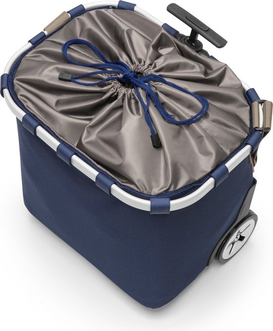 Binnenkant van een donkerblauwe boodschappentrolley met zilverkleurig frame en grijze binnenvoering met trekkoord.
