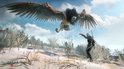 Geralt staat tegenover een vliegend monster met grote vleugels in een besneeuwd landschap.