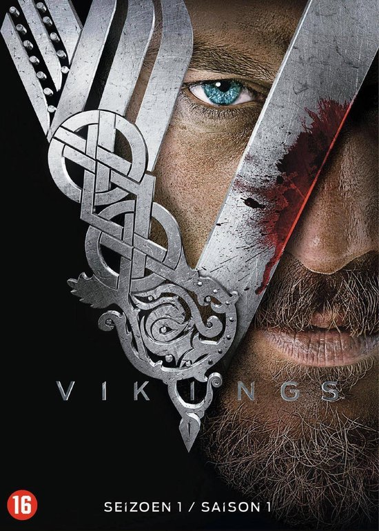 DVD-hoes Vikings Seizoen 1. Een man met blauwe ogen, baard en een zilverkleurig Vikingsymbool met bloed.