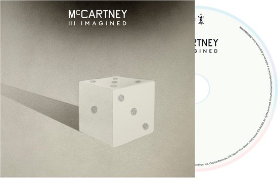 Albumcover met een dobbelsteen en de CD van McCartney III Imagined.