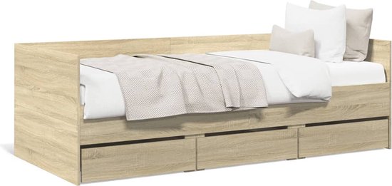 Dagbed met lades in eikenkleur, opgemaakt met beddengoed en kussens.