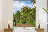 Behang - Fotobehang Palmboom - Zee - Tropisch - Breedte 195 cm x hoogte 300 cm