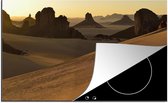 KitchenYeah® Inductie beschermer 77x51 cm - Zonsondergang in het Nationaal park Tassil n'Ajjer - Kookplaataccessoires - Afdekplaat voor kookplaat - Inductiebeschermer - Inductiemat - Inductieplaat mat