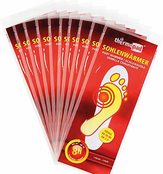 Neuf emballages de semelles chauffantes thermopad, rouges avec illustration de pied. Taille S.