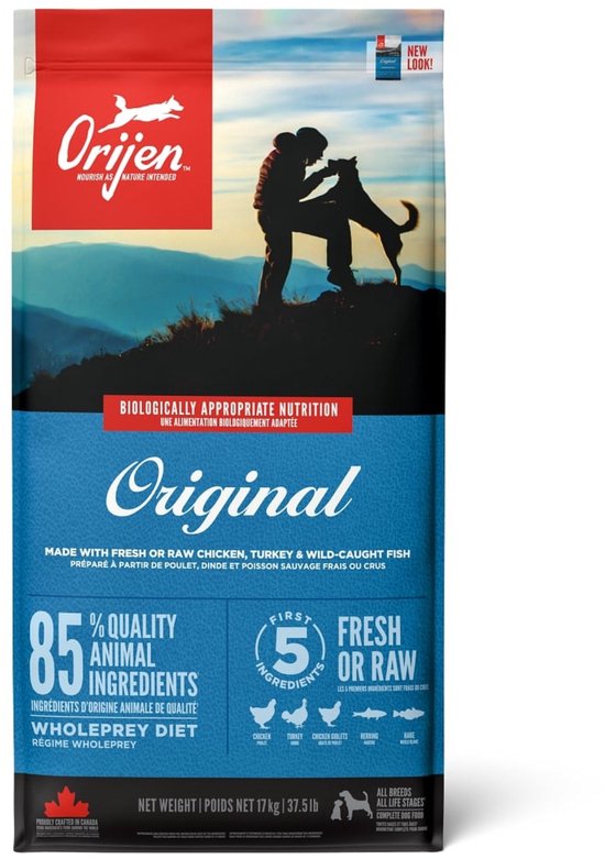 Orijen Original hondenvoer verpakking, met een silhouet van een persoon en hond tegen een berglandschap.