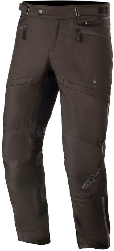 Pantalon de moto Alpinestars noir avec des accents réfléchissants sur le côté, partiellement couvert par le logo Alpinestars.
