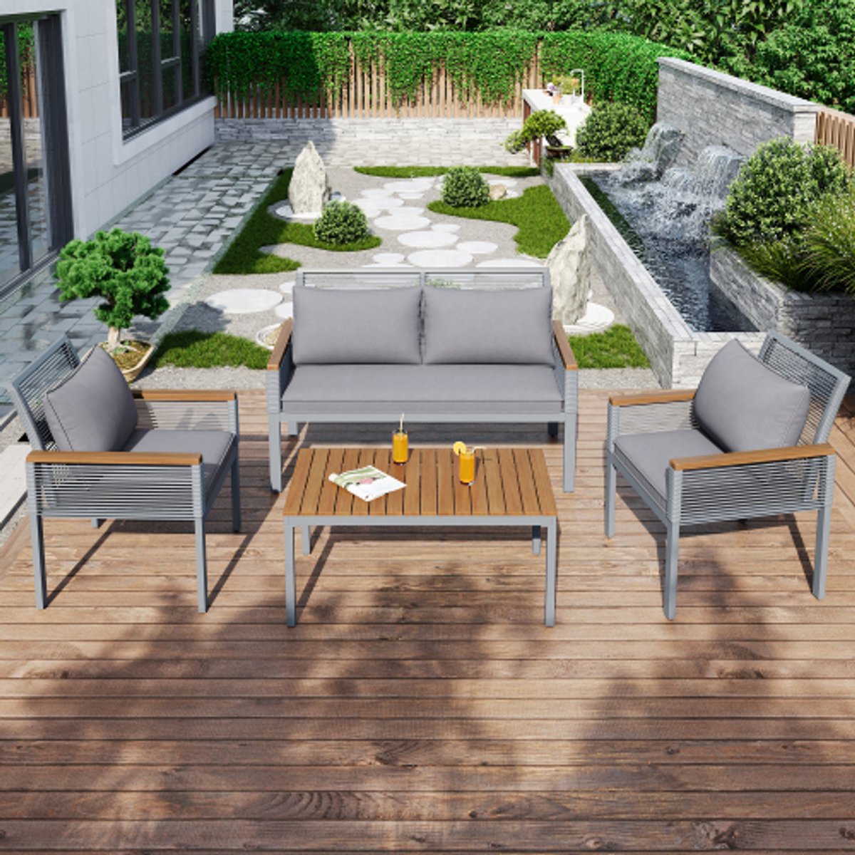 Tuin loungeset met grijze rotan meubels en comfortabele kussens.
