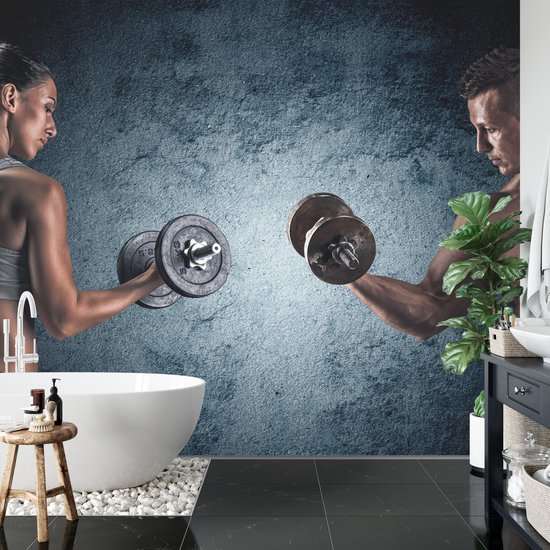 Fotobehang Gespierde Man Een Atletische Vrouw - Vliesbehang - 416 x 254 cm