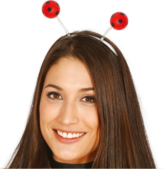 Diadeem met twee rode lieveheersbeestjes met zwarte stippen op een zilveren veer.