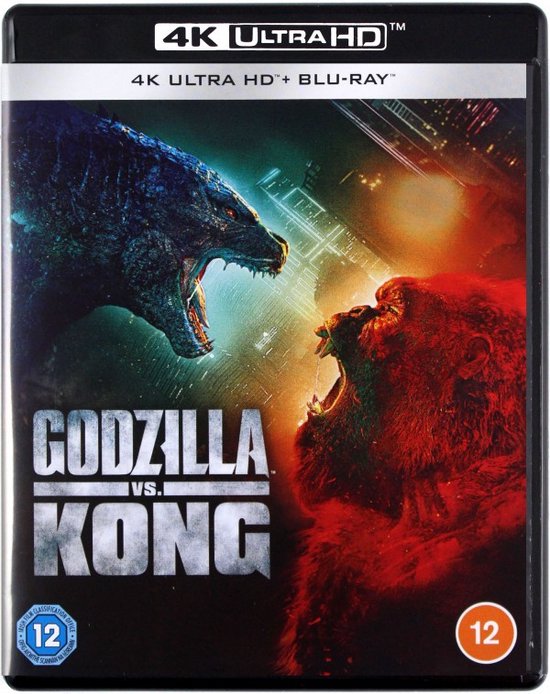 Godzilla et King Kong avec la gueule ouverte, prêts à se battre. Le titre 'Godzilla vs Kong' est bien visible.