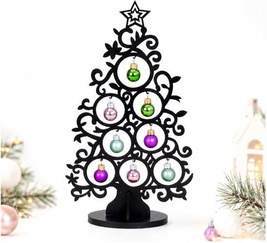 Arbre de Noël décoratif noir avec des branches fines et des boules de Noël vertes, violettes et roses.