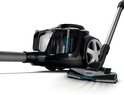 Philips PowerPro Expert stofzuiger met slang en mondstuk op witte achtergrond.