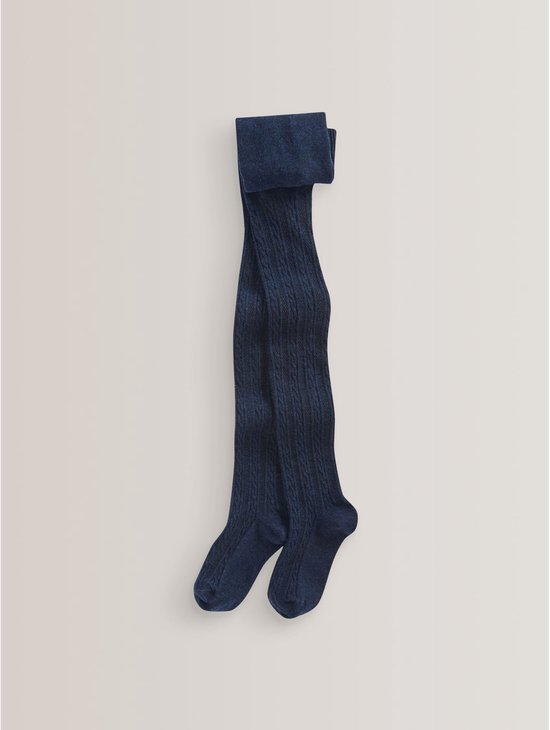 Donkerblauwe panty met een klassiek kabelpatroon, plat neergelegd op een neutrale ondergrond.