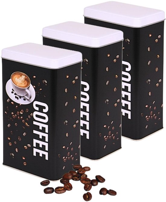 Drie zwarte voorraadblikken met witte deksels, bedrukt met 'COFFEE' en koffiebonen. Eén blik toont een kopje koffie.