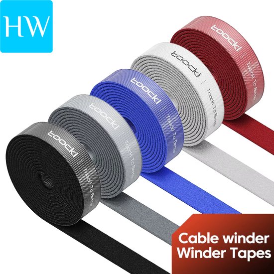 Gekrulde rollen zwarte, grijze, lichtgrijze, blauwe, witte en rode klittenbandsluitingen, merk 'toocki'.