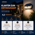 AXIMO solar buitenlamp 's avonds aan een muur, met sterbeoordelingen en klantrecensies. 'Voldoende licht', 'Mooi design' en 'Hoge kwaliteit'.