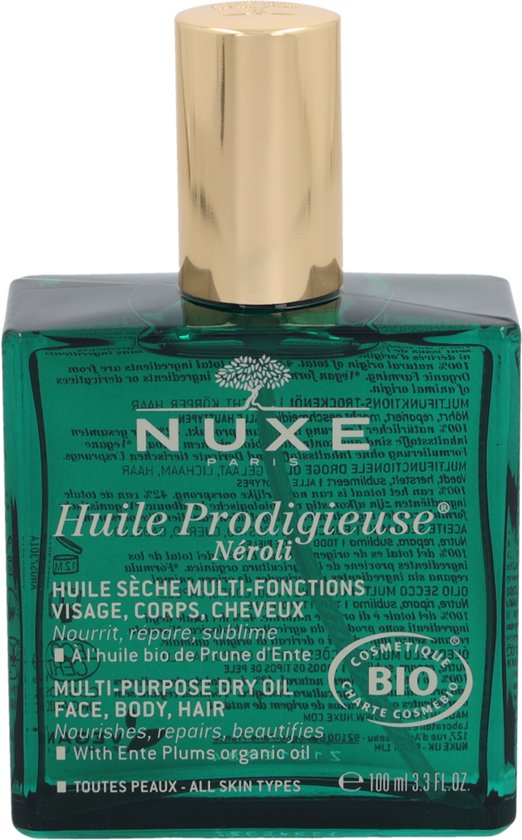 Groene Nuxe Huile Prodigieuse Néroli fles met gouden dop. De tekst op de fles is weerspiegeld.