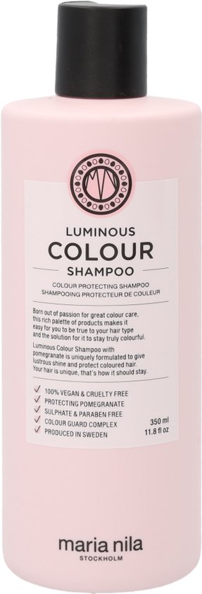 Lichtroze fles met zwarte dop, met het "Luminous Colour Shampoo" logo en productdetails.