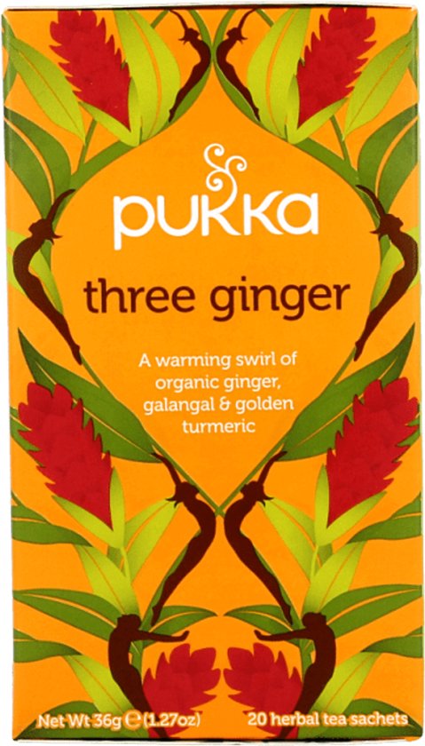 Pukka three ginger thee verpakking met oranje achtergrond en afbeeldingen van gemberbloemen en bladeren.