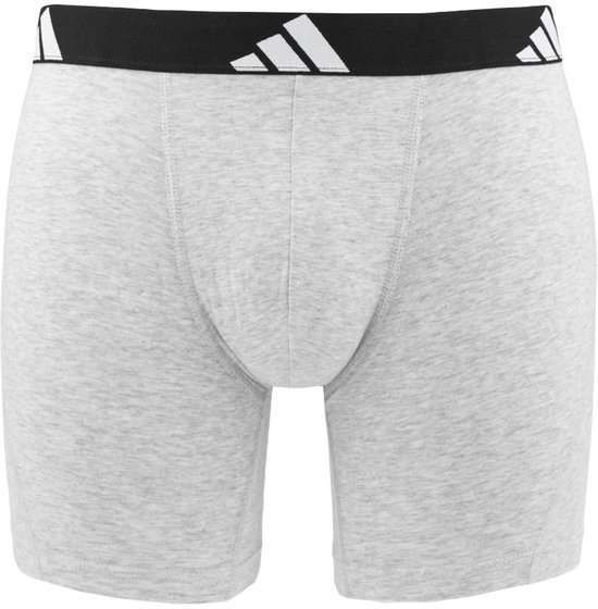 Lichtgrijs boxerhort met zwarte band met witte Adidas logo's.