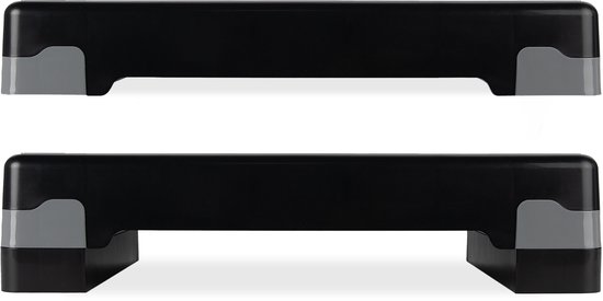 Zwarte aerobic step op 10cm hoogte, en dezelfde step op 15cm hoogte.